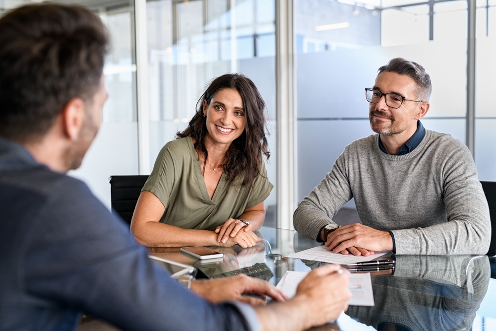man and woman talking to insurance company.